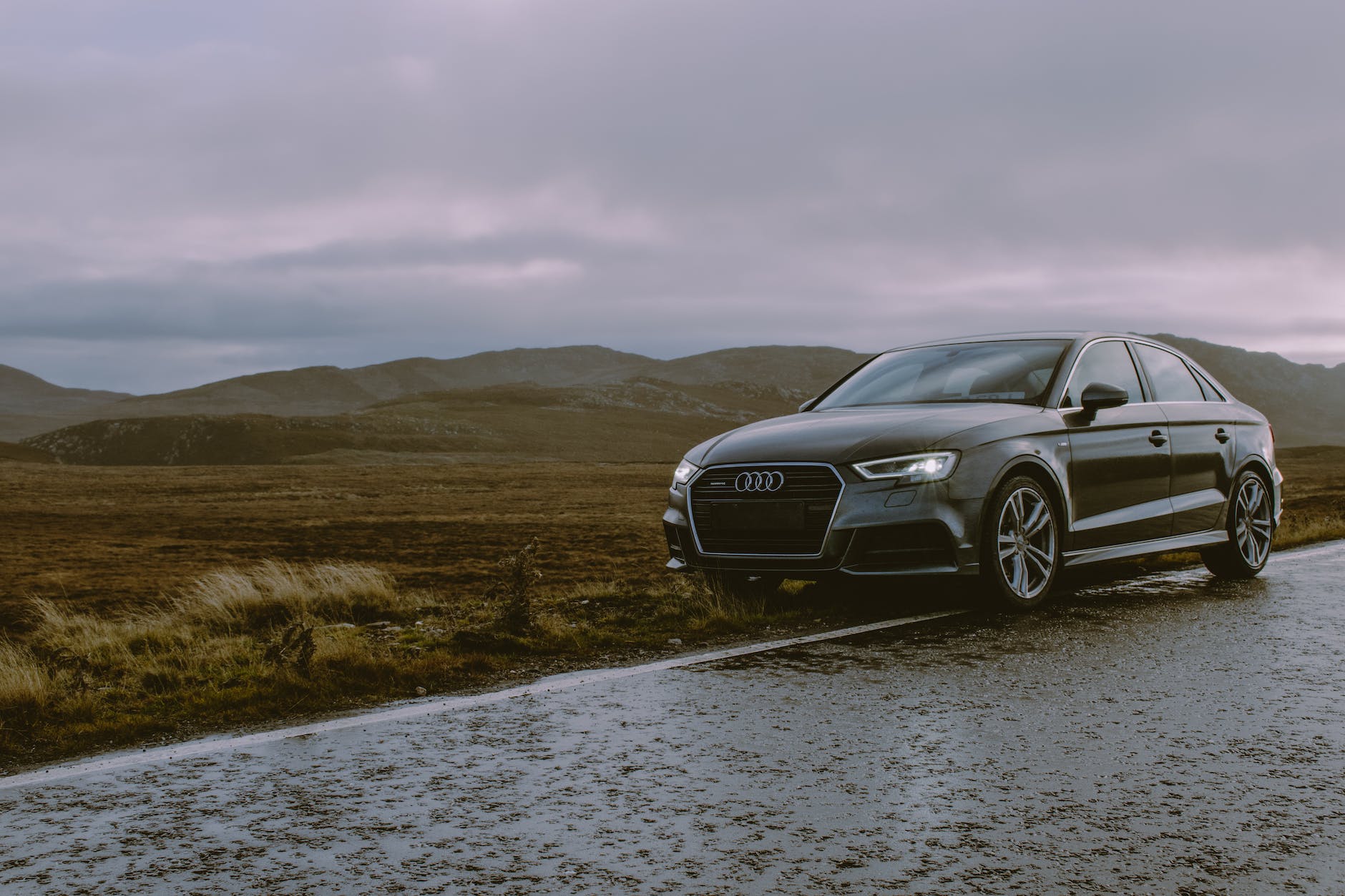 photo of black audi parked on roadside